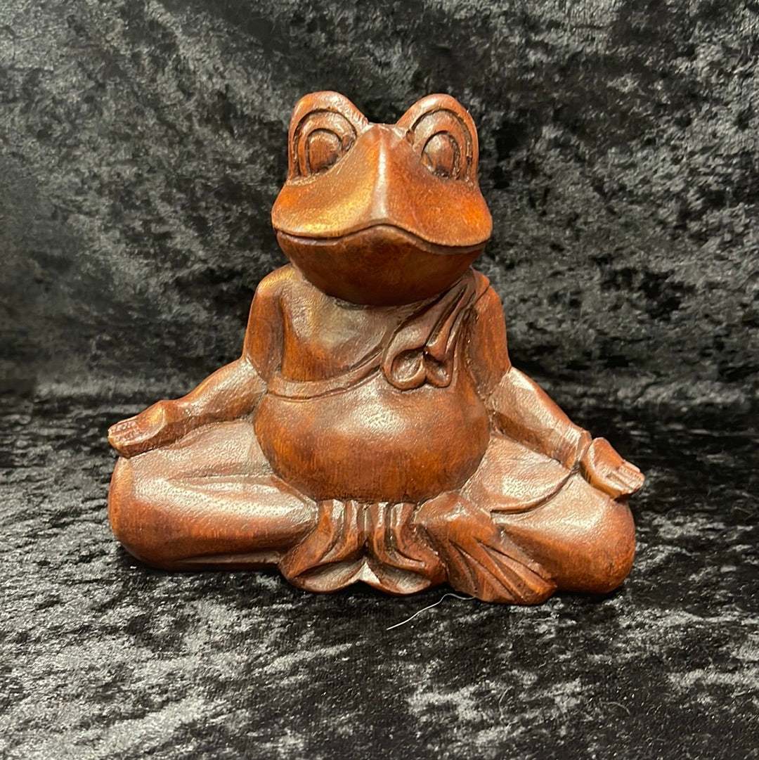 Wooden meditating figurines