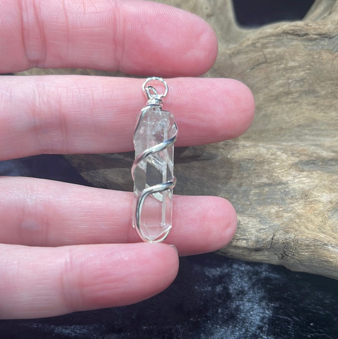 Spiral wrapped crystal pendants