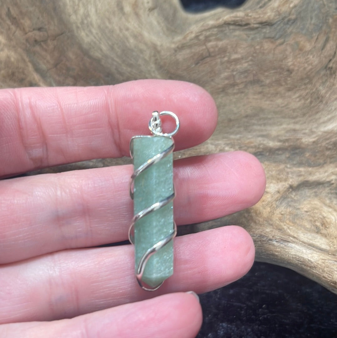 Spiral wrapped crystal pendants