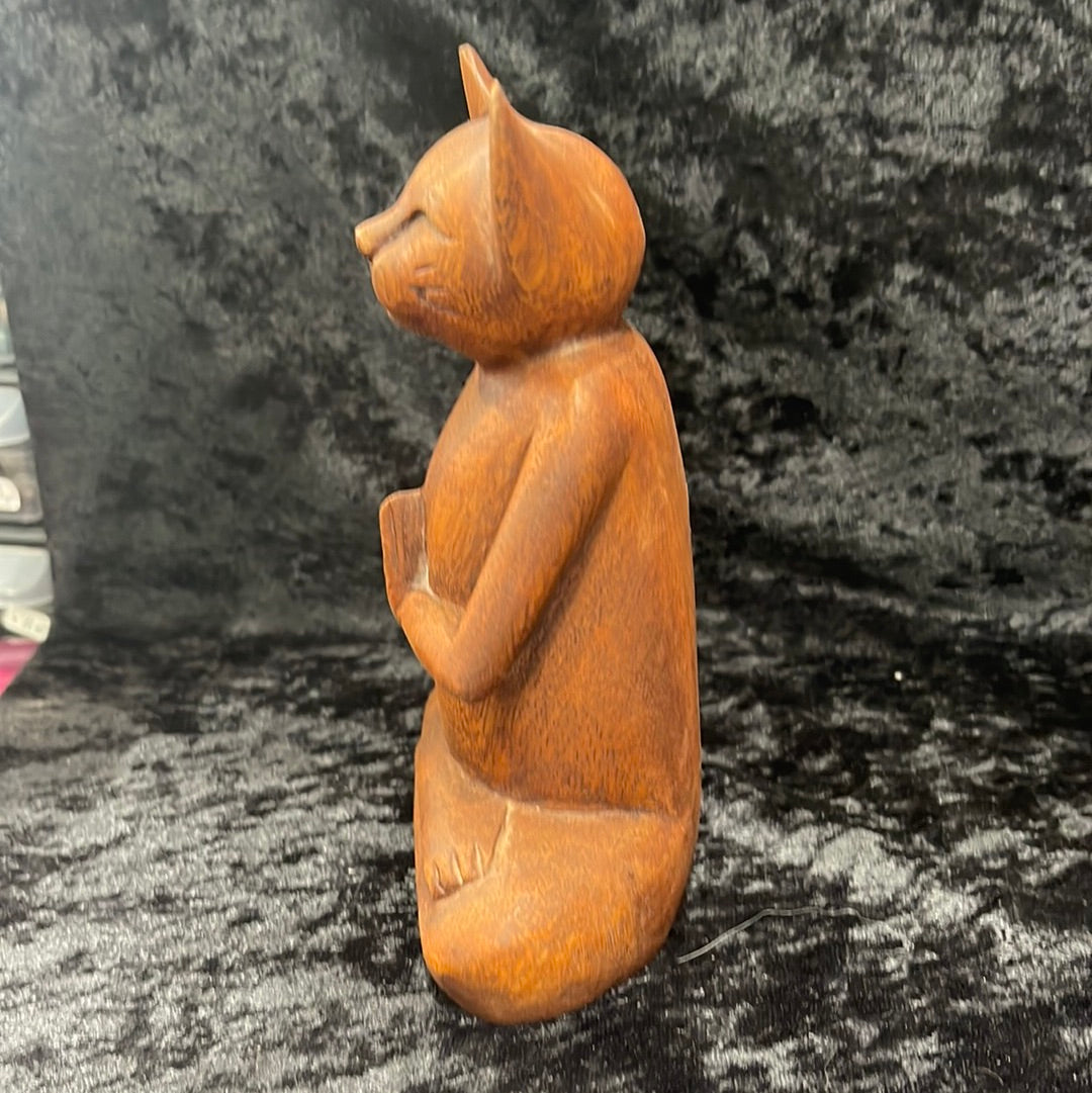 Wooden meditating figurines