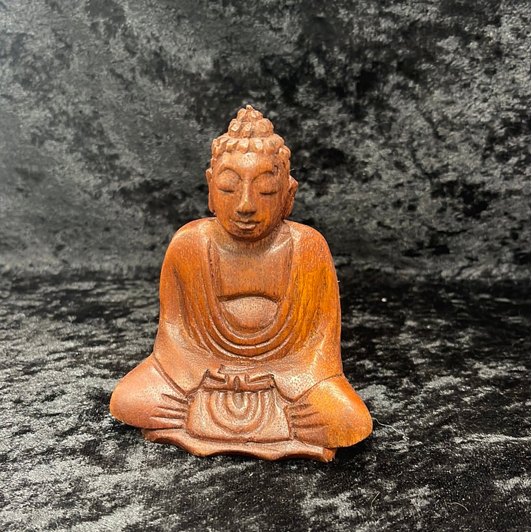 Wooden meditating figurines