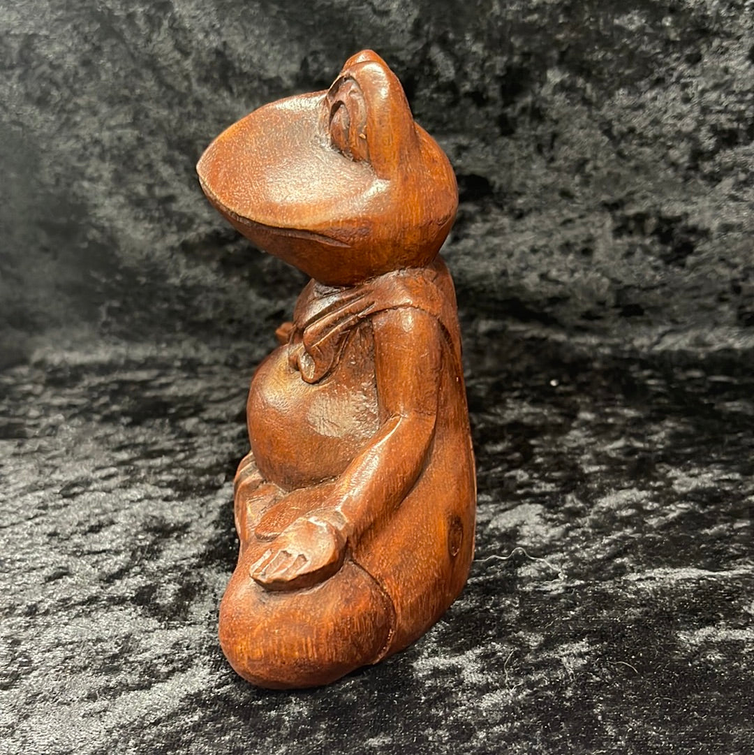 Wooden meditating figurines