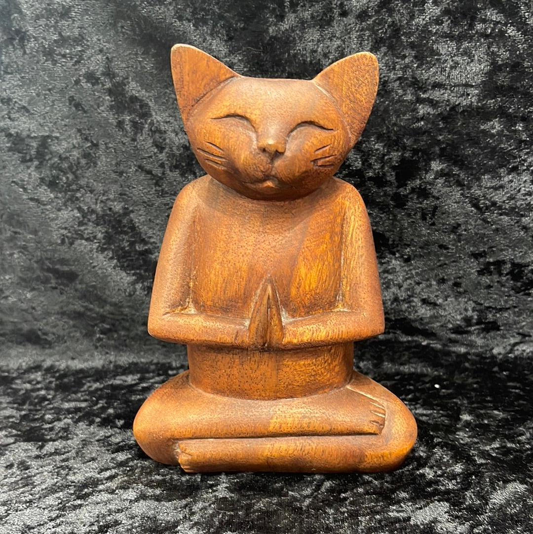Wooden meditating figurines