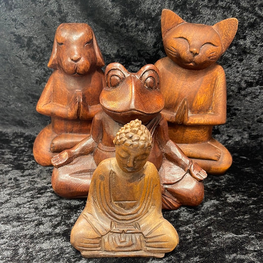 Wooden meditating figurines