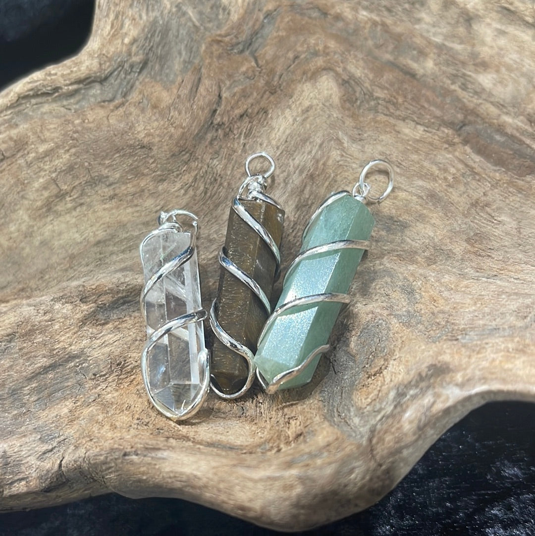 Spiral wrapped crystal pendants