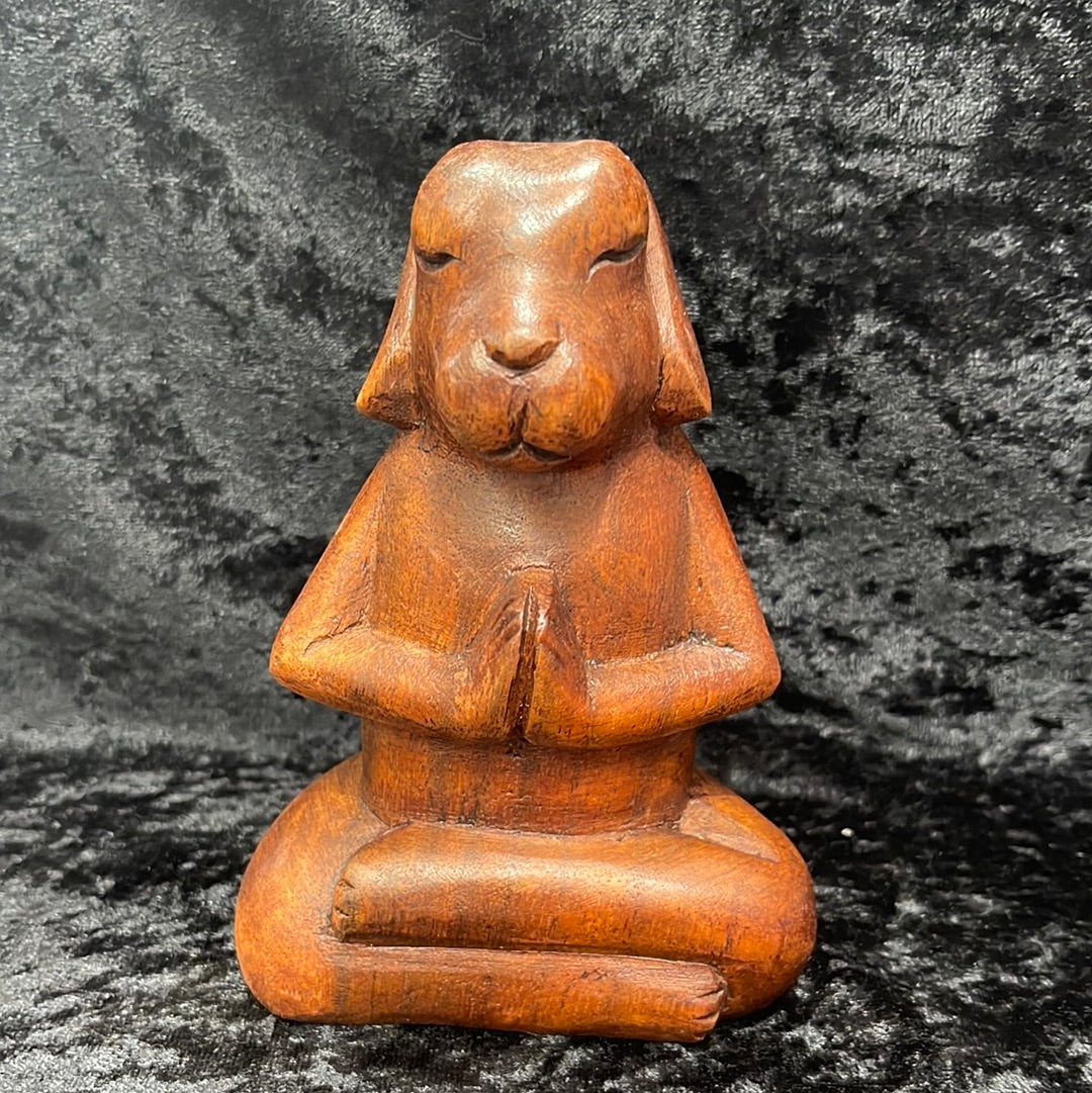 Wooden meditating figurines
