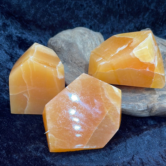 Orange calcite polished forms