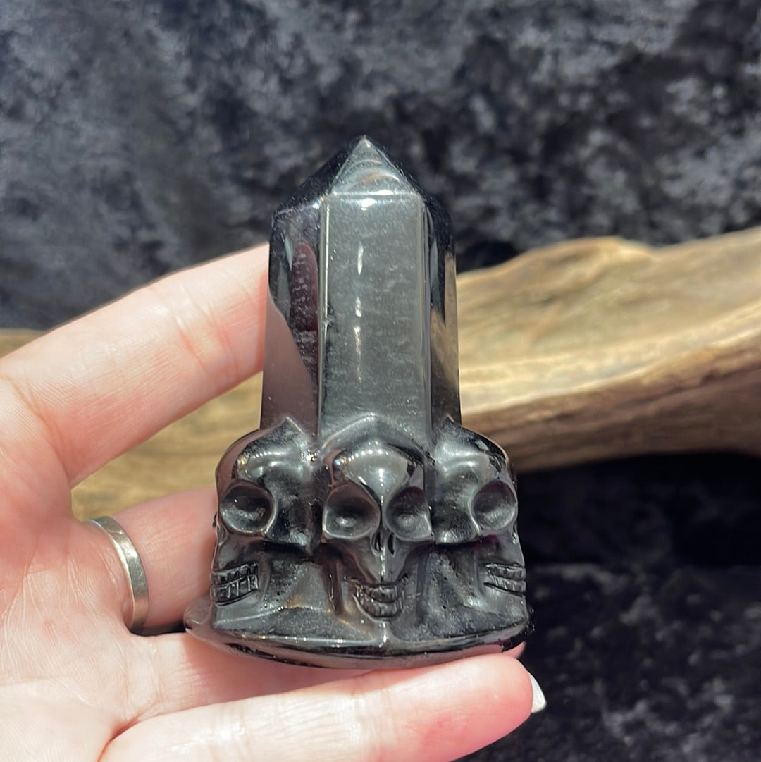 Obsidian tower with skulls